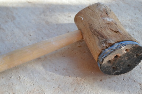 Mallet carved then fastened with a cutting from an old flip flop.